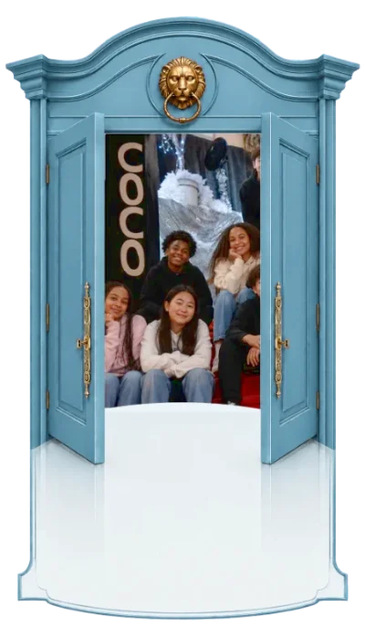 Blue Wardrobe opening to middle school to high school youth sitting on the steps of Coco's selfie space.